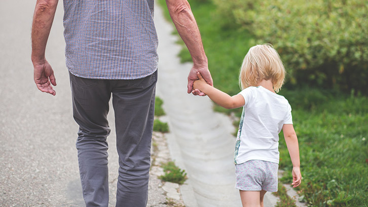 child-walking-with-grandparent