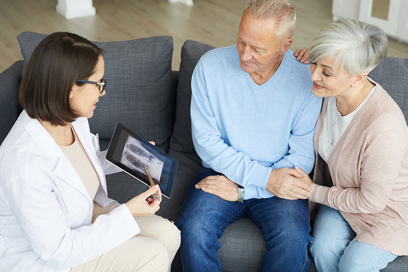 patient-and-caregiver-with-doctor