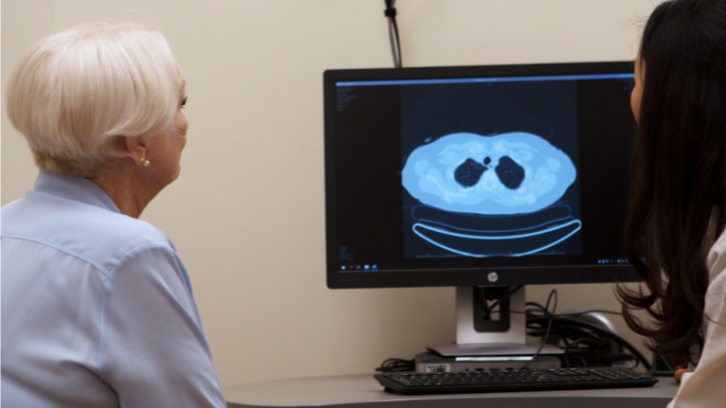 pulmonary-fibrosis-patient-and-doctor-examining-HRCT-scan